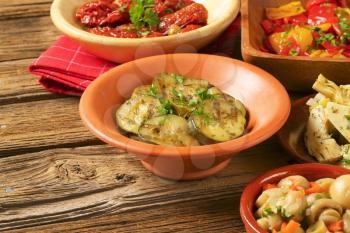 bowl of assorted pickled vegetables on wooden background