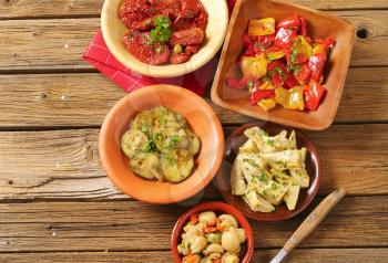 bowl of assorted pickled vegetables on wooden background