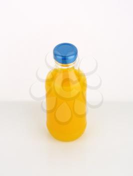 bottle of orange juice on white background