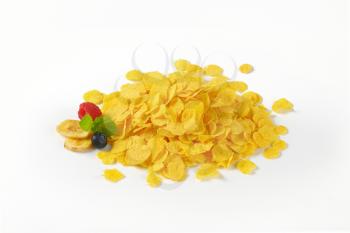 pile of corn flakes on white background