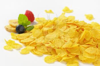 pile of corn flakes on white background - close up