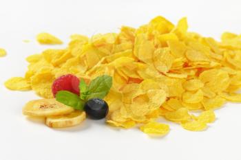 pile of corn flakes on white background - close up