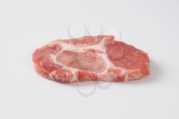 raw pork steak on white background