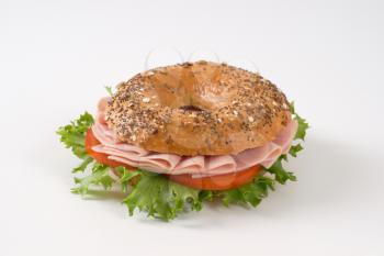 bagel sandwich with ham on white background
