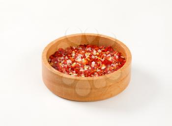 bowl of dried pepper and salt on white background