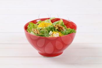 bowl of Chinese cabbage salad with orange, walnuts and blue cheese