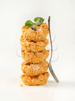 Stack of almond crumb cookies on  white background