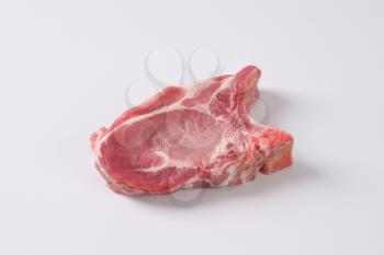 raw pork cutlet on white background