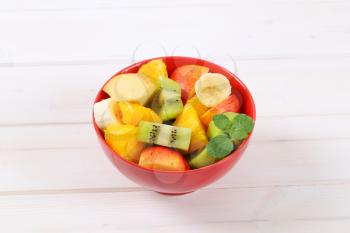 bowl of fresh fruit salad on white background