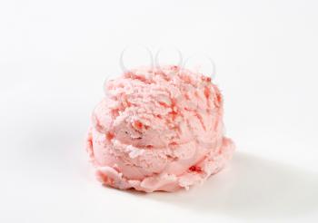 single scoop of strawberry ice cream on white background