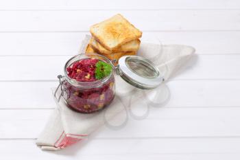 jar of fresh beetroot spread with toast on place mat