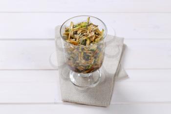 Zucchini salad with pumpkin seeds, sunflower seeds and pine nuts