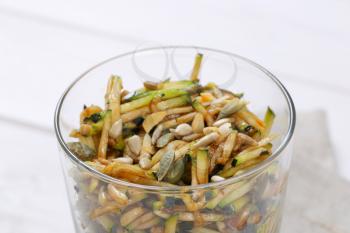 Zucchini salad with pumpkin seeds, sunflower seeds and pine nuts