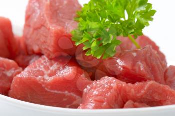 bowl of diced raw beef meat - detail