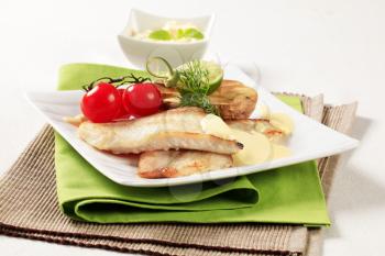 Pan fried fish fillets with roasted potato