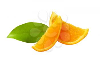 Fresh orange wedges and leaf on white background