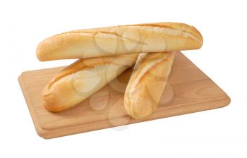 three french baguettes on wooden cutting board
