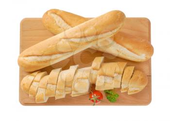 whole and sliced french baguettes on wooden cutting board