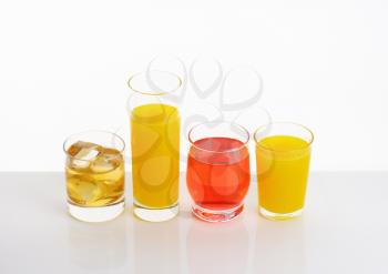 variety of fresh fruit juices on white background