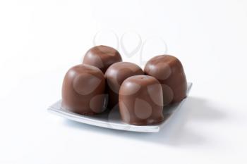 Marshmallows coated in milk chocolate