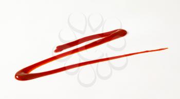 red drizzle sauce on white background