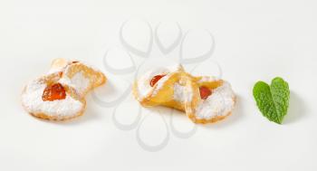 cookies with apricot jam filling on white background