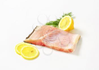 Raw carp fillet with lemon and dill