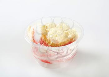 Rest of strawberry shortcake dessert in plastic cup
