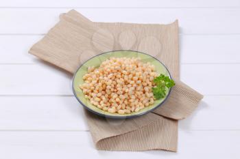plate of canned white beans on beige place mat