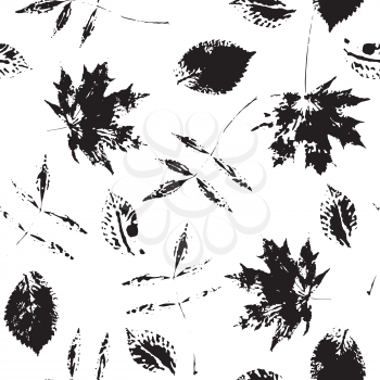 Seamless pattern with paint prints of leaves isolated on a white background