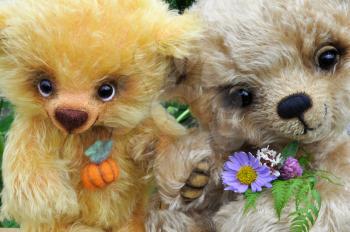 Handmade, the sewed toys: two friends teddy bears among flowers