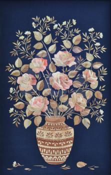 Handmade, applique, bouquet of roses made of straw in a vase made of birch bark