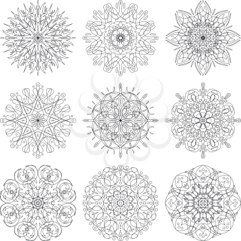 Set of abstract symbolical floral black patterns, design elements, isolated on white. Vector