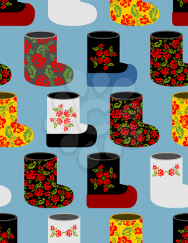 Russian traditional winter shoes seamless pattern. Valenki background. Flower ornament  national footwear in Russia.
