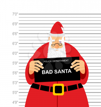 Mugshot is bad Santa. Arrested Sana Claus at  police station holding a sign. Christmas  offender in  bruise under eye. His grandfather was detained for fight.
