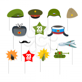 23 February. Set photo props for photo shoot. Elements for photographing. Defender of fatherland day in Russia. Military equipment and clothing items soldiers. Green Beret and moustache. Helmet on a s