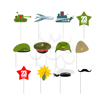 23 February. Set photo props for photographing. Paper items military accessories for photo shoot. Day of defenders of  fatherland. Tank and plane. Warship and green beret. Pomegranate and whiskers.
