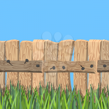 Wooden fence and blue sky. Old wooden planks and green grass. Fence of wooden board stands on green meadow. Fence seamless horizontal pattern.
