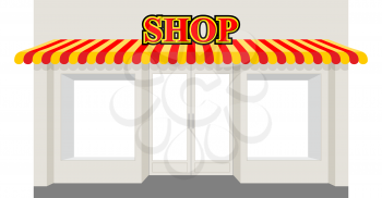 Store showcase. Facade of  shop building. Storefront with striped awning.
