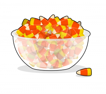 Bowl and candy corn. Sweets on plate. Traditional Treats for Halloween
