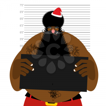 African American Santa at police station. Mugshot Black Santa gangster. Afro hairstyle and red Christmas hat.
