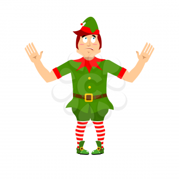 Surprised Christmas elf raised his hands to sides. Discouraged assistant of Santa Claus. wonderl at  little man in green suit. XMAS character for new year

