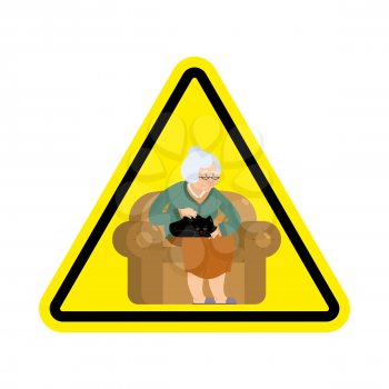 Attention grandmother. Caution old woman and cat. Yellow triangle road sign
