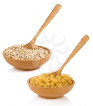 raw pasta and oat cereals in wooden plate isolated on white background