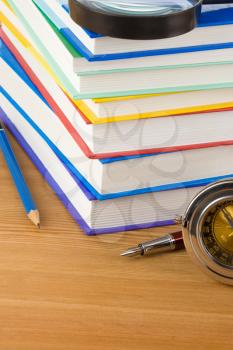 pile of books on wood background