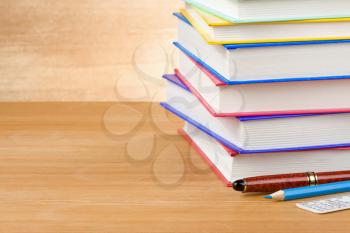 pile of books on wood background