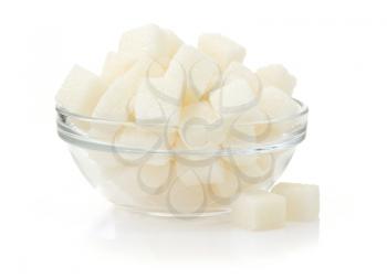sugar cubes in bowl isolated on white background