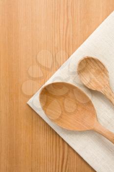 wood spoon as utensils on wooden background