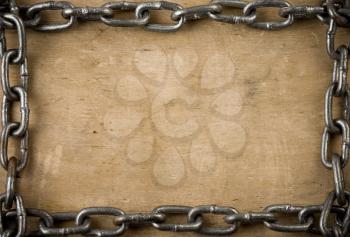 metal chain on old wood background texture