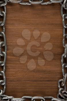 metal chain on wood background